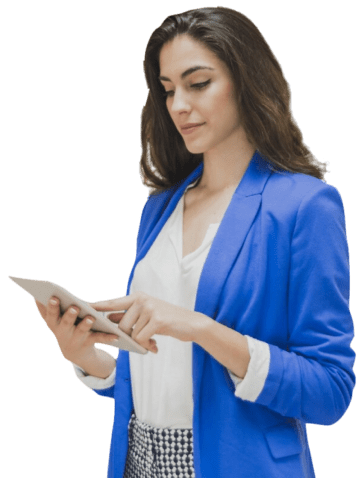 image of a young woman with black hair scrolling on a laptop wearing blue suit and white top